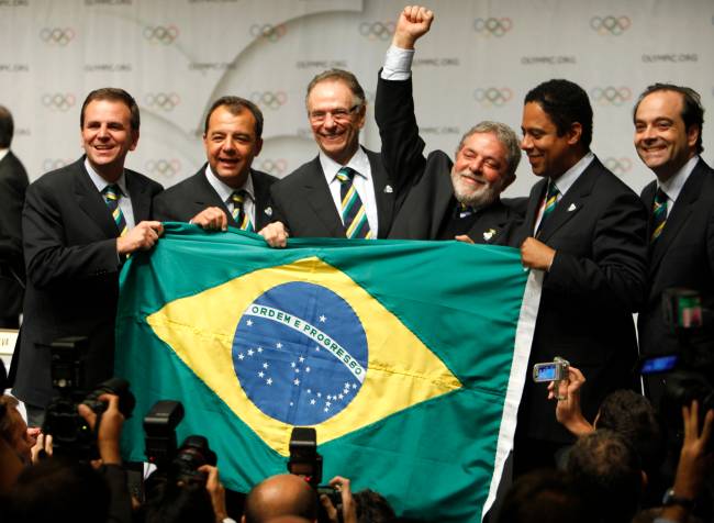 Members of Rio de Janeiro 2016 bid committee celebrate following the signing of the host city contract for the 2016 Olympic Games during the 121st IOC session in Copenhagen