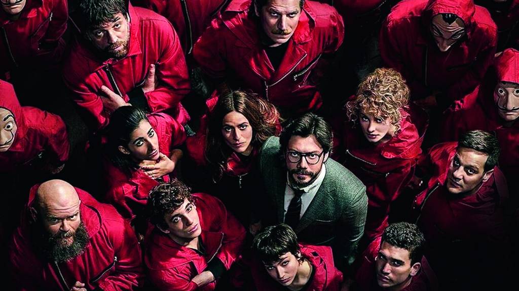 La casa de papel Personagens de La Casa de Papel, com o macacão vermelho, em volta do Professor