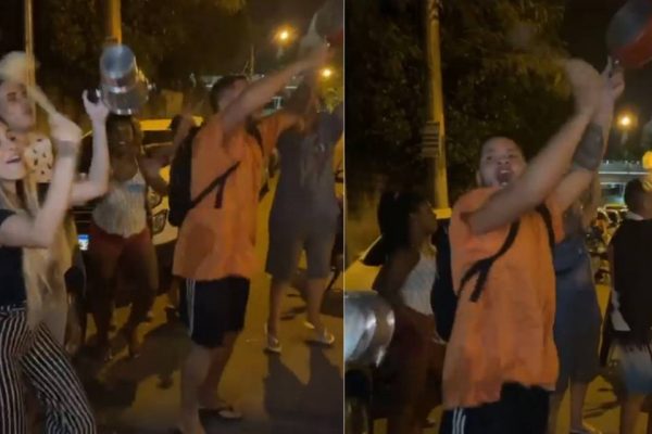 Grupo de pessoas bate panelas em revolta