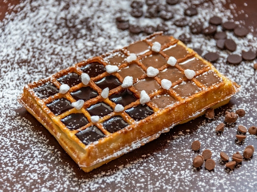 Em Copacabana, a Belga Wafel trz calda de chocolate belga e brigadeiro com especiarias