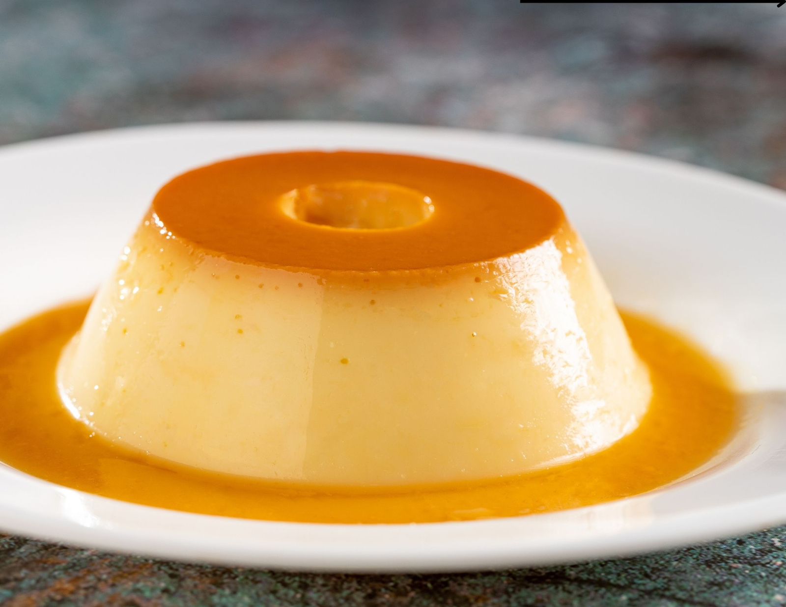Receita: Saiba como preparar e desenformar um pudim de leite perfeito